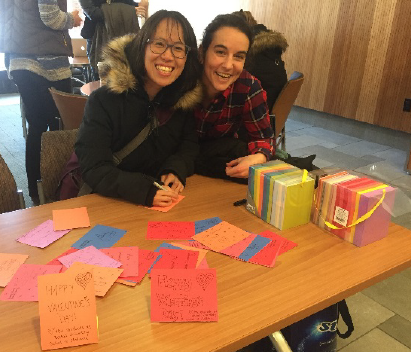 (L to r) Alicia Wong, '17 and Nicole St. Omer Roy, '18, with the Valentine's cards.