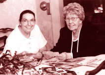 Betty Colleran, 70, and mother Elizabeth Stanton, 100, together looking at family photographs.