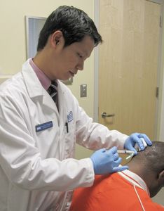 Pat doing injections Trainees have primary patient responsibilities and receive hands-on training in all dermatologic procedures under direct faculty supervision.