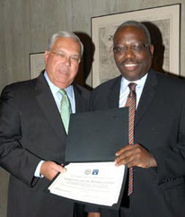 Mayor Thomas M. Menino (left) presents Harold Cox with a certificate of appreciation for the School's contribution to Boston's H1N1 prevention campaign. (Photo by Don Harney/City of Boston)