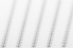 Scanning electron microscope image (above) of an array of microfabricated particles being developed for use as a multi-spectral magnetic resonance imaging (MRI) contrast agent. (Xin Zhang, Stephan Anderson)