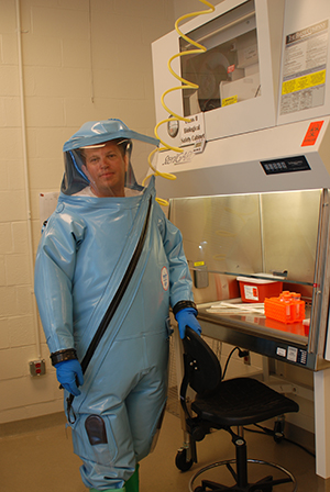 Immunologist Gene Olinger, in the attire of his profession, thinks existing drugs for depression and heart disease might be effective against Ebola. Photo courtesy Gene Olinger