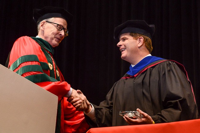 Robert Meenan (MED’72, Questrom’89), SPH dean for 21 years, with Boston Mayor Martin Walsh at the school’s 2014 Convocation. Photo by Melissa Ostrow