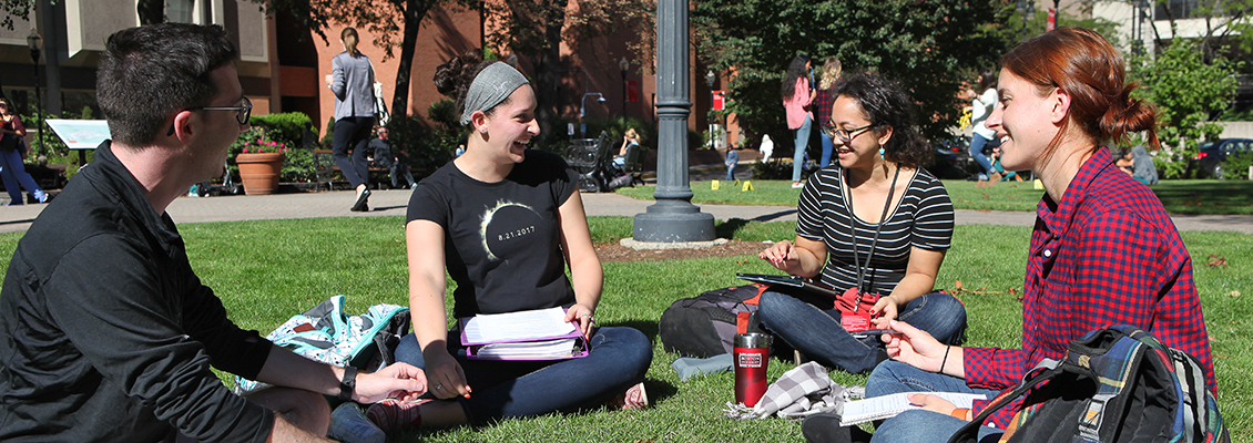 Students studying outside on BU's campus