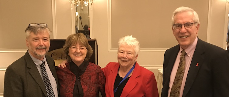 program faculty standing together smiling