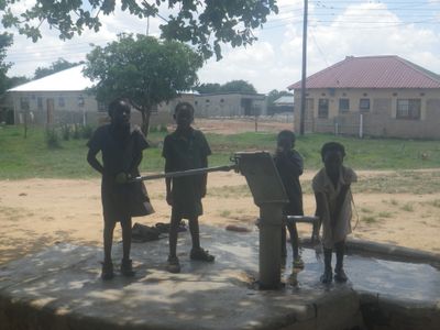 Children pumping water