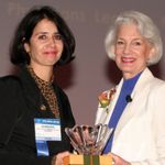 Marie-France Memierre, MD (left) receives the 2009 Women's Dermatolgoic Society President's Award.