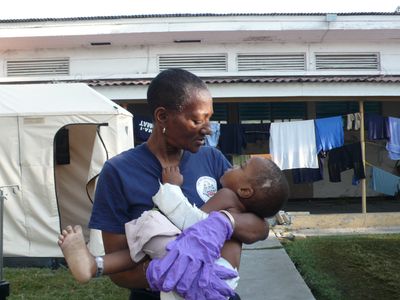 Dr. Thea James tending to a patient in the aftermath of the earthquake Dr. Thea James tending to a patient in the aftermath of the earthquake.