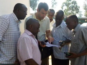 Lankowski web1 Alexander Lankowski, showing Ugandan people how to maneuver a GPS.
