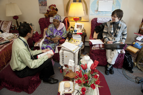 GERIATRIC Eugene Lee (CAS’08, MED’12) (left) and Lisa Norton, a School of Medicine clinical assistant professor, on a home care visit to 87-year-old Pauline Harris. Photos by Vernon Doucette
