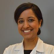head and shoulders image of Dr. Vashi wearing a white coat, smiling broadly