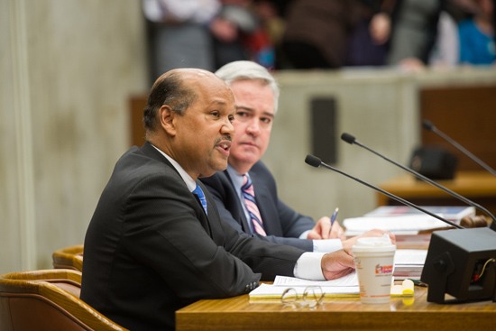 Boston City Councillor Charles Yancey addresses the City Council during last night’s hearing at City Hall, where he sought support for his proposal to ban Biosafety Level 4 research at BU’s National Emerging Infectious Diseases Laboratories; next to him is Councillor Michael Flaherty. Photos by Cydney Scott