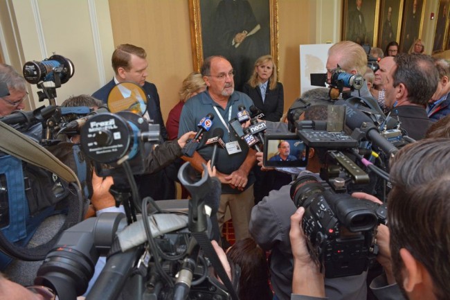 Kevin Turner's father talks with the media after formal presentation.