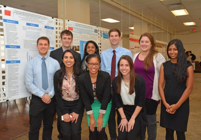 MSSRP participants displayed their research on posters in Hiebert Lounge. Some were selected to present their research, and six students won awards for their work. From left to right, John Lona, Shawn Tuttle, Munizay Paracha, Samantha Venkatesh (honorable mention), Keri-Lee Garel, James Wilson, Sarah Nocco (best science poster winner), Lyndsey Stadtmueller (honorable mention), Betsy Thomas. 