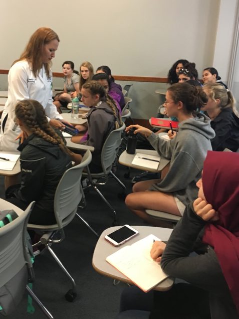 Associate Professor of Neurology Anna Hohler, MD, meets with Summer Pathways students explain how neurologists use Deep Brain Stimulation (DBS) to control symptoms of Parkinsons Disease