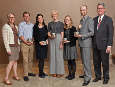 BUMG Education Committee Chair Tracey Dechert, MD with award recipients Drs. James Maypole, Sarah Crane, Shannon Bell, Genevieve Preer, and James Hudspeth, MD, and BUMG CEO William Creevy, MD.