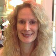 headshot woman with long blond hair smiling