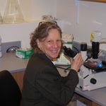 Barbara Schreiber at lab bench smiling