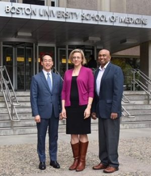 Willis Wang, Natasha Hochberg, Nalin Kulatilaka standing in front of BU School of Medicine