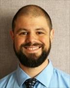 Head and shoulders shot of Eric Marks smiling broadly.