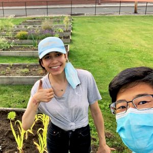 Sara and Sean next to planted raised bed