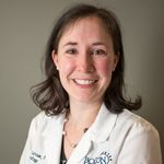 Dr. Larson headshot wearing whitecoat.