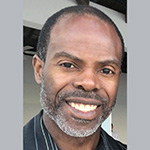 Headshot of Dr. Dedier smiling broadly.