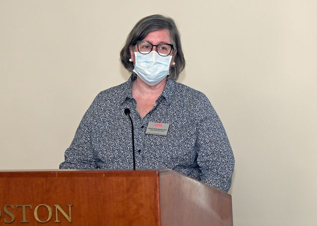 Deborah Stearns-Kurosawa speaking at a podium