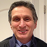 Headshot of Dr. Pena smiling.