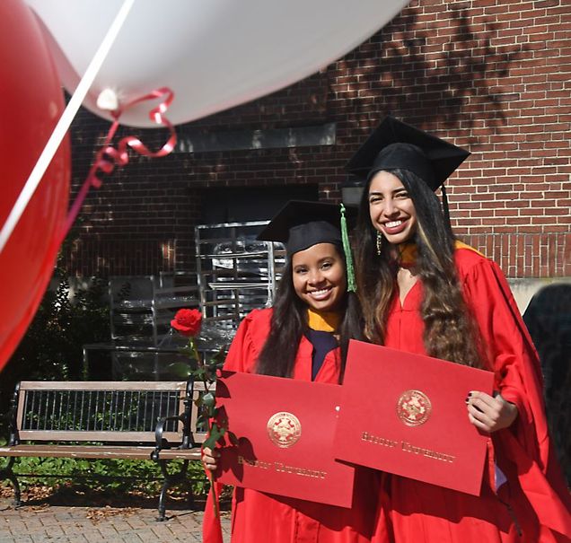 Erica Camacho and Laila Khatib in front of Instructional building.