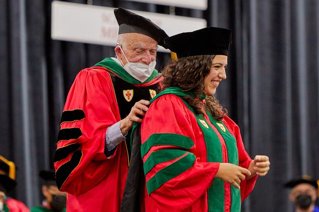 BU President Emeritus Aram Chobanian, MD, hooded his granddaughter Vanessa Torrice