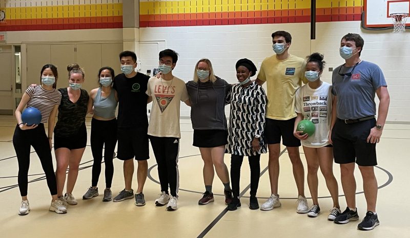 Students participating in dodgeball tournament all lined up in gym