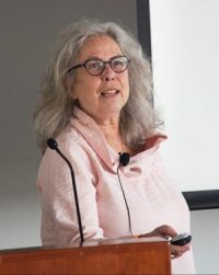 Linda Hyman, PhD speaking at podium