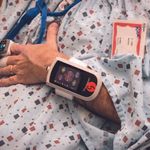 Arm with heart monitor device on it