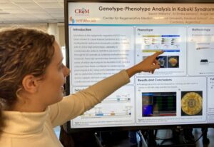 Person pointing at large research poster