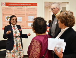 Woman talking to three people