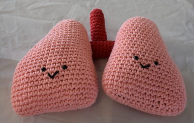 Pink colored lungs with smiling faces