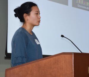 Rose Zhao speaking at podium