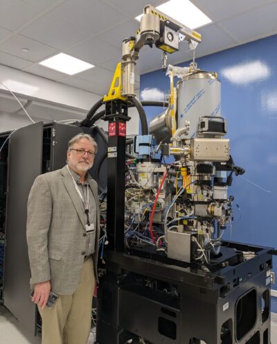 Jamie McKnight beside the cryoEM