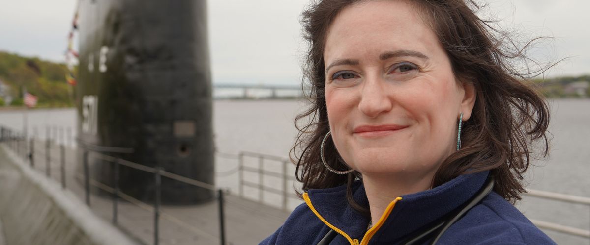 Adrienne Parad, MD (CAMED’07), in front of the historic USS Nautilus at the Submarine Force Museum in Groton, Connecticut. Parad served seven years in the Navy, including at the Naval Submarine Base New London, Connecticut.