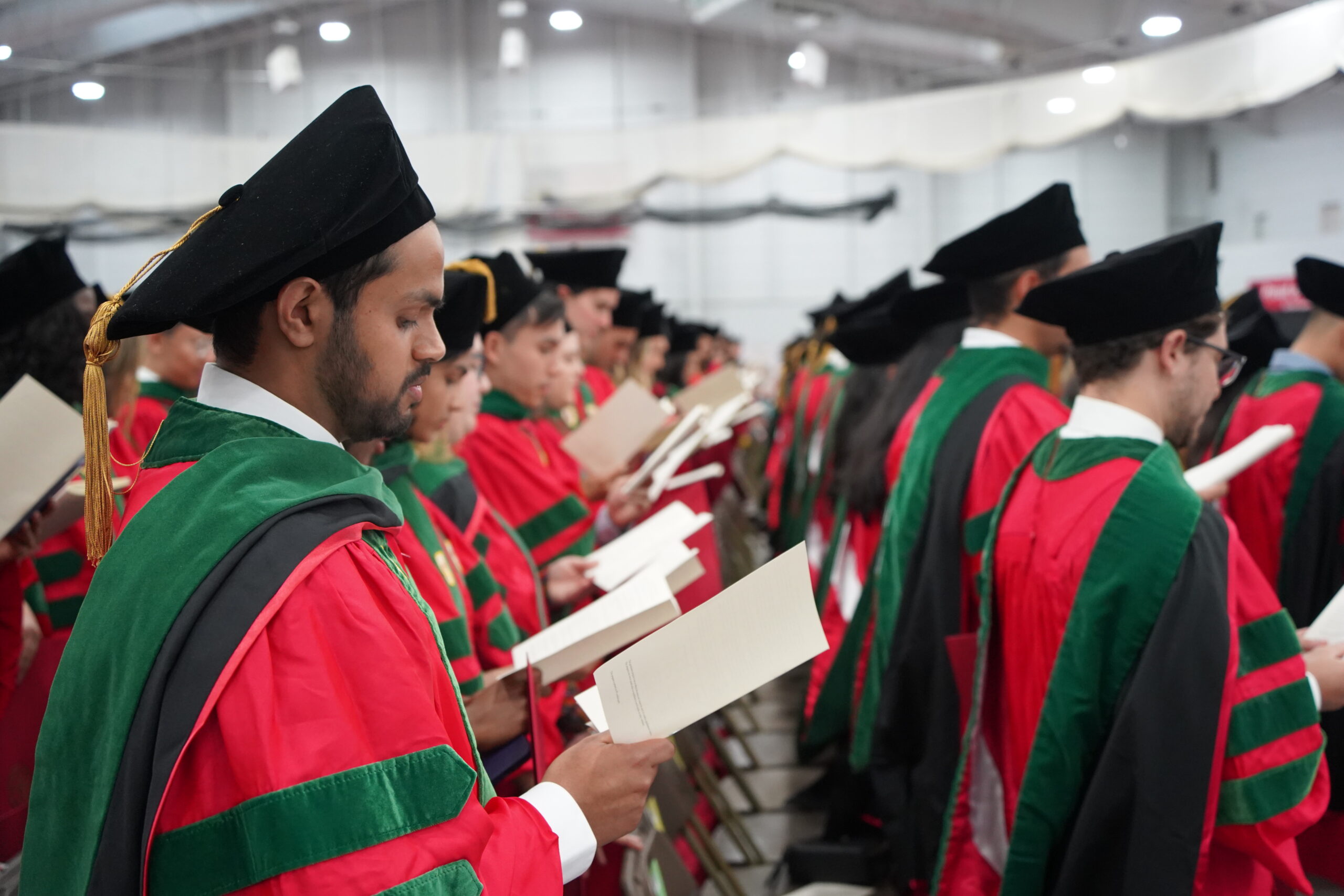 MD students standing reciting hippocratic oath