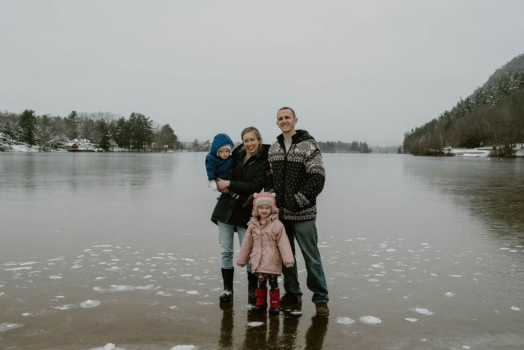 Emily Nelson with her family outside in front of a body of water