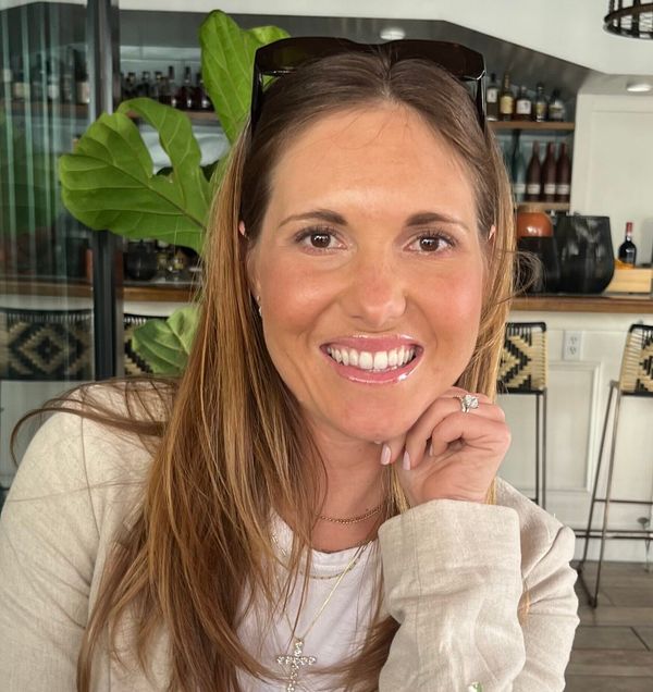 head and shoulders shot of Margaux Dockerty smiling broadly