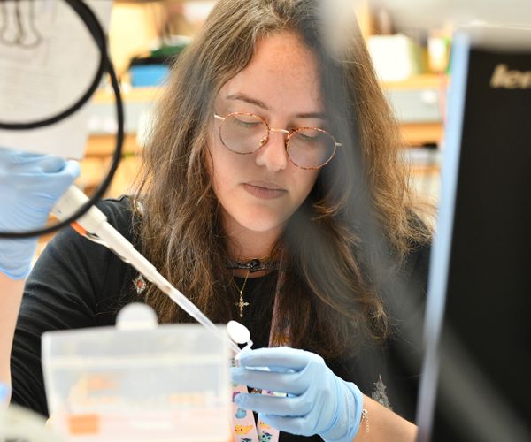 A person working with equipment in a laboratory setting