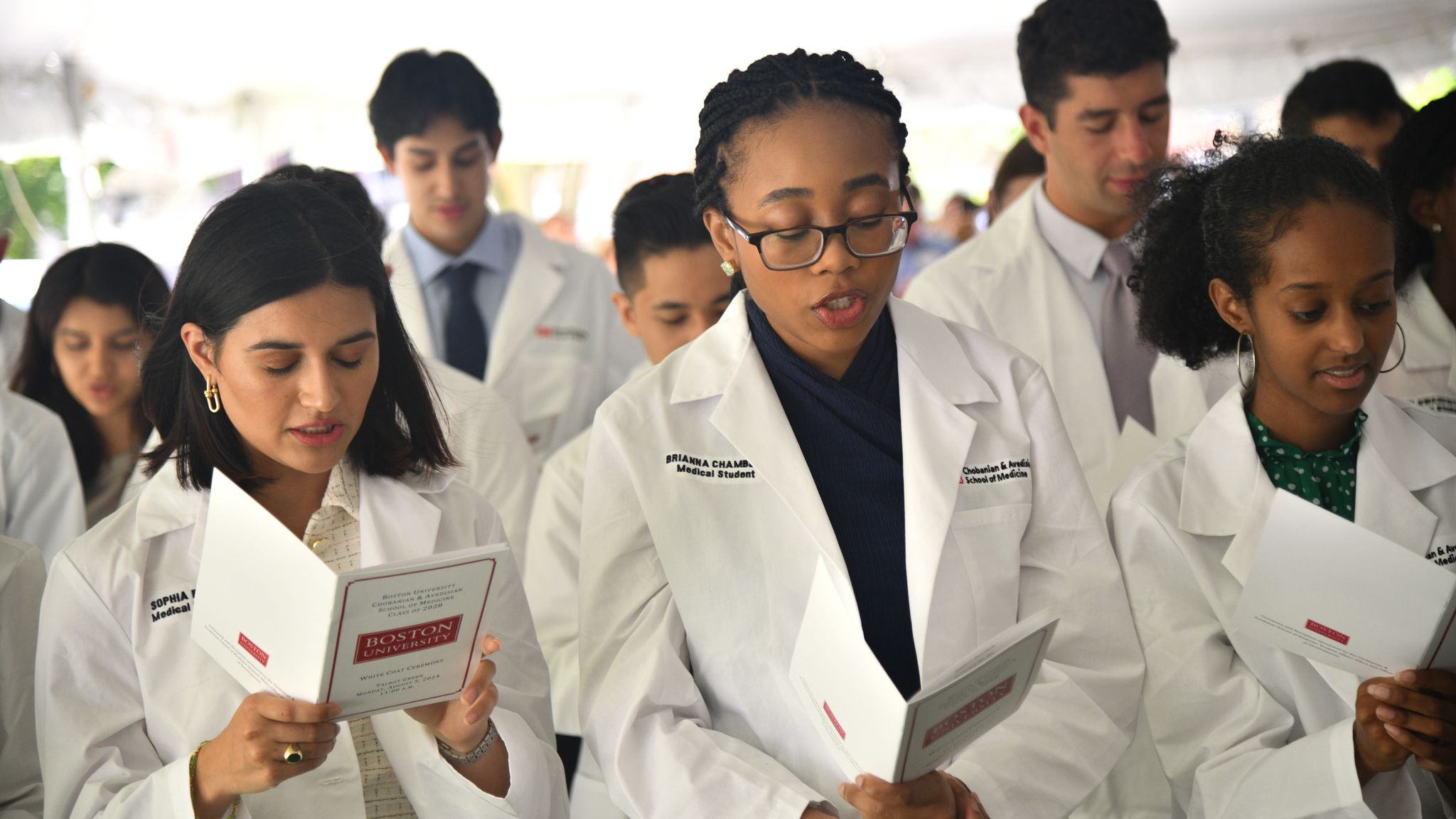Students reading hippocratic oath for the first time.