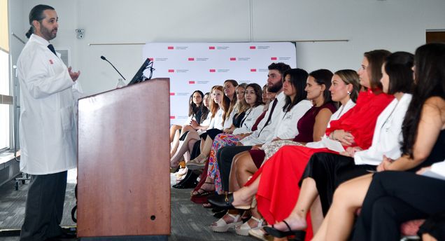 Oren Berkowitz delivering the keynote address at the PA whitecoat ceremony