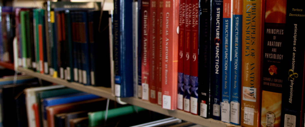 Library shelf with medical textbooks