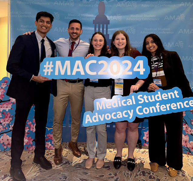 Five individuals at the Medical Student Advocacy Conference holding a #MAC2024 sign.