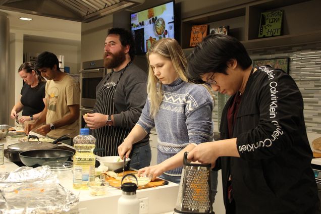 Students teaching cooking class