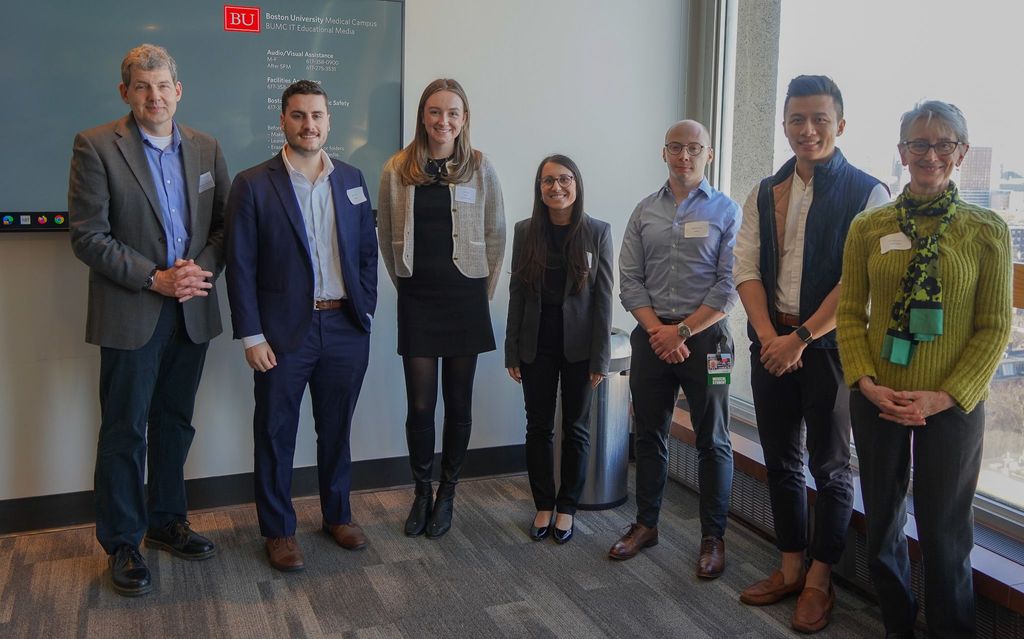 Assistant Dean of Research and MSSRP Director with student presenterswith students